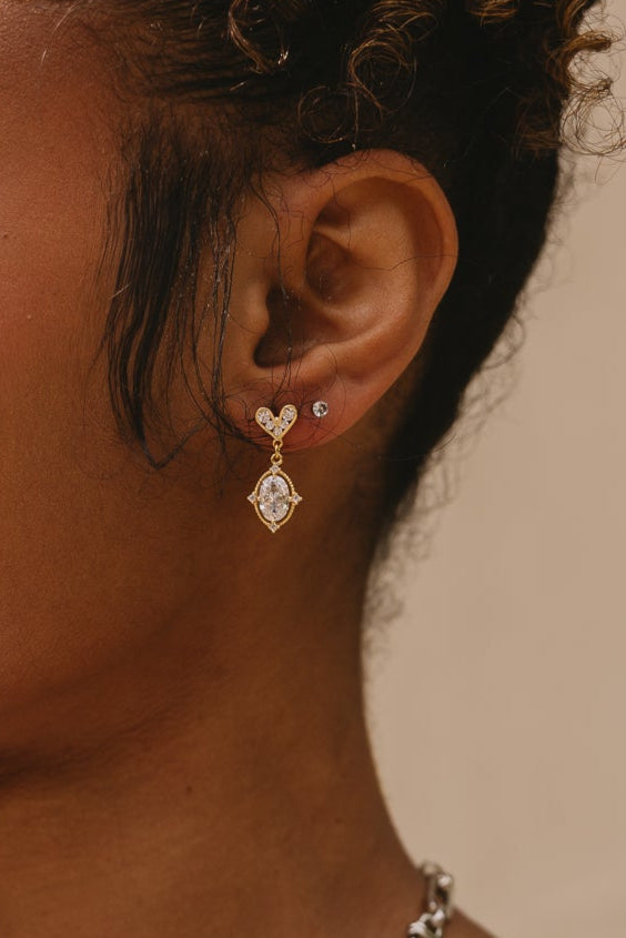 Erica Rhinestone Heart Dangle Earrings - close up on model