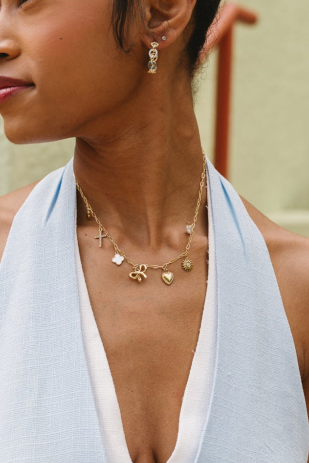 Emily Gold Charm Necklace - close up view on model
