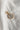 Image shows the 'T' alphabet charm against a white background. Charm is a gold circle with pearlescent center and has gold letter T in the center.
