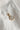 Image shows the 'K' alphabet charm against a white background. Charm is a gold circle with pearlescent center and has gold letter K in the center.