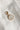 Image shows the 'S' alphabet charm against a white background. Charm is a gold circle with pearlescent center and has gold letter S in the center.