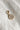Image shows the 'Q' alphabet charm against a white background. Charm is a gold circle with pearlescent center and has gold letter Q in the center.