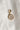 Image shows the 'Q' alphabet charm against a white background. Charm is a gold circle with pearlescent center and has gold letter Q in the center.