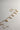 Image shows the Kennedy Gold Chain Link Necklace against a white background. Necklace has gold circle and oval links. Shown with 5 assorted charms added.