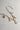 Image shows the bottom of the Kennedy Gold Chain Link Necklace against a white background. Necklace has gold circle and oval links. Shown with 6 assorted charms added.
