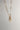 Image shows the bottom of the Sadie Gold Textured Chain Link Necklace against a white background. Necklace has skinny oval gold textured chain links. Shown with charms added.