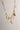Image shows the Maria Gold Oval Chain Link Necklace against a white background. Necklace has gold oval links. Shown with 5 charms added.