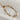 Image shows the Bethany Gold Textured Chain Link Bracelet against a white background. Bracelet has gold textured oval links.