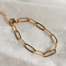 Image shows the Bethany Gold Textured Chain Link Bracelet against a white background. Bracelet has gold textured oval links.