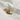 Image shows gold heart charm against a white background.