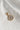 Image shows the 'H' alphabet charm against a white background. Charm is a gold circle with pearlescent center and has gold letter H in the center.
