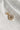 Image shows the 'W' alphabet charm against a white background. Charm is a gold circle with pearlescent center and has gold letter W in the center.