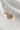 Image shows the 'W' alphabet charm against a white background. Charm is a gold circle with pearlescent center and has gold letter W in the center.