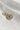 Image shows the 'P' alphabet charm against a white background. Charm is a gold circle with pearlescent center and has gold letter P in the center.