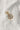Image shows the 'F' alphabet charm against a white background. Charm is a gold circle with pearlescent center and has gold letter F in the center.