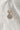 Image shows the 'U' alphabet charm against a white background. Charm is a gold circle with pearlescent center and has gold letter U in the center.