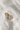 Image shows the 'D' alphabet charm against a white background. Charm is a gold circle with pearlescent center and has gold letter D in the center.