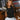 Lylah Black Cinched Tie Sleeveless Top- front view paired with white skirt