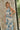 Elliana Beige & Blue Floral Halter Midi Dress - close up front view