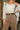 Jocelyn Black & Gold Faux Leather Belt - front view on model