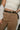 Jocelyn Black & Gold Faux Leather Belt - close up front view on model
