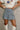 Nicole Denim Ties Pleated Flare Mini Skirt- close up front view