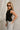 Lylah Black Cinched Tie Sleeveless Top- frontal side view
