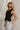 Lylah Black Cinched Tie Sleeveless Top- side view