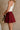 Kelsey Burgundy Pleated Skort -close up side view