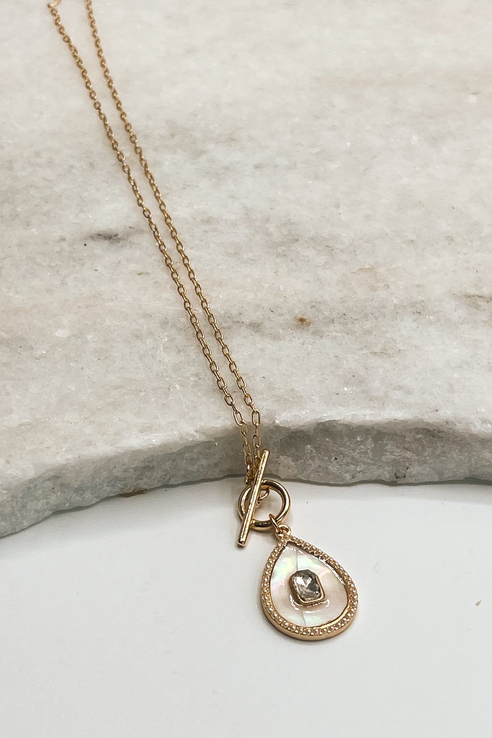 The Krista Necklace is shown on a neutral background.