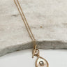 The Krista Necklace is shown on a neutral background.