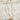 Close up of April Bow Pearl and Gold Necklace, gold chain link and clear beads with a gold bow medallion on it. 