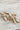 Close up of Camille Gold and Ivory Bow Studs that have striped detailing. 