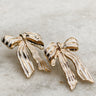 Close up of Camille Gold and Ivory Bow Studs that have striped detailing. 