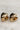 Alternate view of the The Raine Earrings is shown against a neutral background. They are gold heart-shaped studs.
