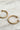 Close up of Hadley Gold Hoop Earrings, brushed gold hoops with pearl end details.