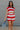 Front view of female model wearing the Bristol Red & White Stripe Sleeveless Top which features  Red and Cream Stripe Lightweight Fabric Slits on the side, Round Neckline and Sleeveless