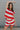Front view of female model wearing the Bristol Red & White Stripe Sleeveless Top which features Red and Cream Stripe Lightweight Fabric Slits on the side, Round Neckline and Sleeveless