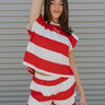Front view of female model wearing the Bristol Red & White Stripe Sleeveless Top which features Red and Cream Stripe Lightweight Fabric Slits on the side, Round Neckline and Sleeveless