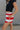 side view of female model wearing the Bristol Red & White Stripe Shorts which features Red and Cream Stripe Lightweight Fabric, Cream Lining, Elastic Waistband and Pockets on each side