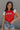 front view of female model wearing the USA Red & White Short Sleeve Top which features Red and White Lightweight Fabric, Color Block Pattern, Round Neckline, Short Sleeves and USA graphic stitch design