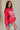 side view of female model wearing the USA 1996 Red Long Sleeve Sweatshirt which features Lightweight Red Fabric, Round Neckline, Long Sleeves, Ribbed Hem and USA 1996 graphic with white, red and blue stitch design