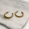 Close up of Brynn Gold Ribbed Hoops, open medium hoops.