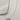 Image shows Love White & Blue Cylinder Necklace against a white background. Necklace has 6 sided cylinder - 2 white sides that say love, 2 blue sides, and 2 black sides with a geometric design.