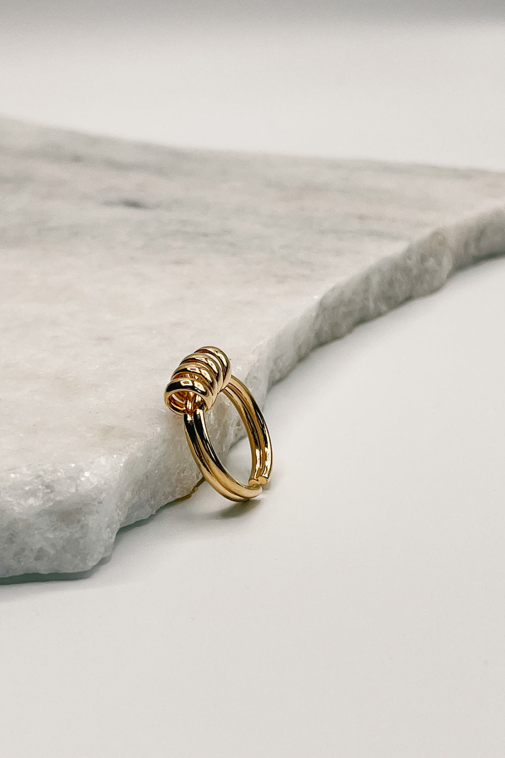 Close up of side of Jasmine Gold Spiral Ring, gold ring with spiral detail.