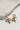 Close up of London Gold Ribbed Bow Earrings, gold ribbed bow shaped stud earrings.