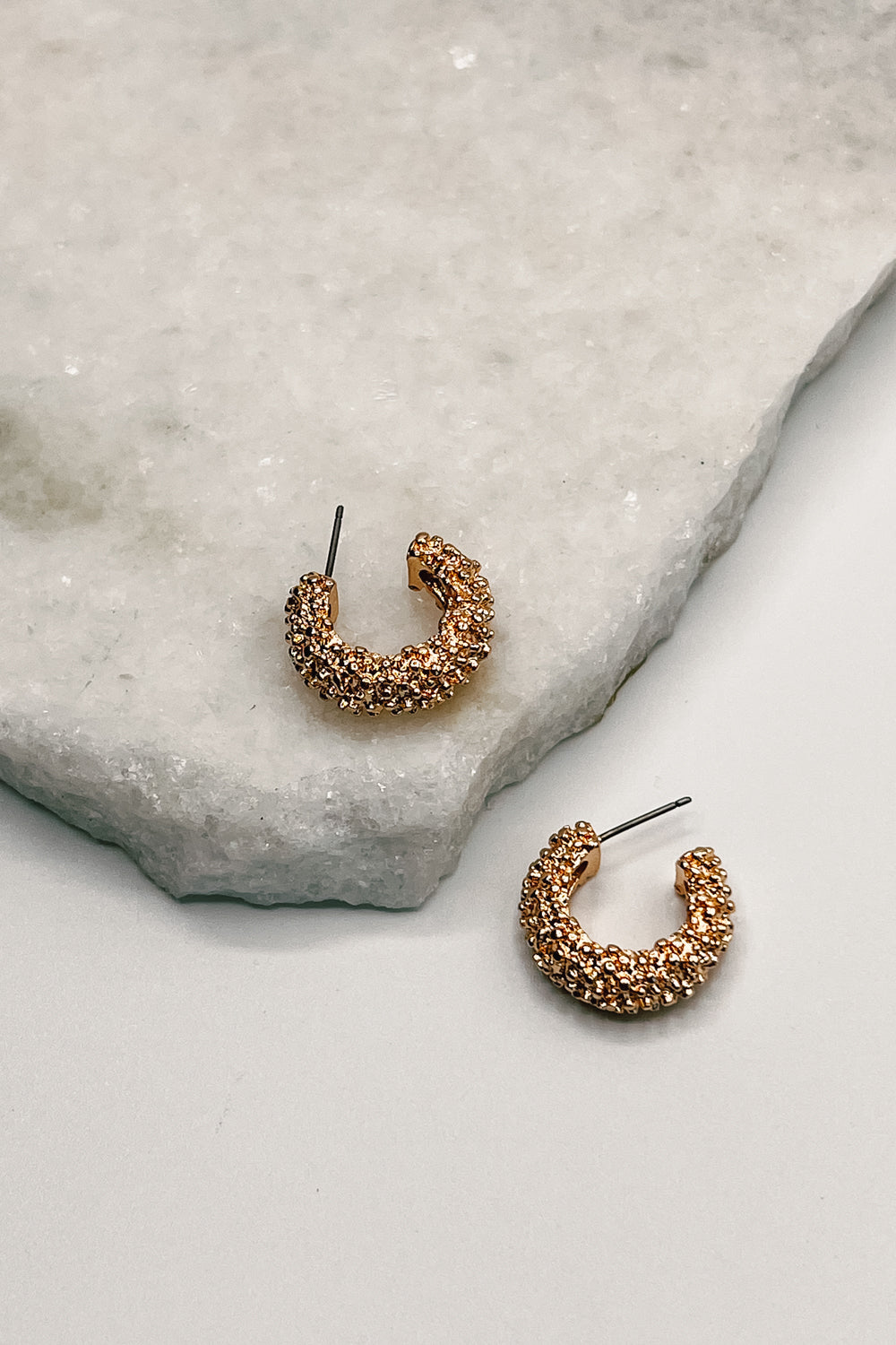 Close up of Anna Gold Textured Hoops.