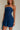 frontal side view of female model wearing the Amaya Strapless Flare Mini Dress which features Lightweight Fabric, Side Zipper Closure, Belt Loops, Two Front Pockets, Strapless and Shorts Lining. the dress is available in red and navy blue