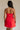 back view of female model wearing the Amaya Strapless Flare Mini Dress which features Lightweight Fabric, Side Zipper Closure, Belt Loops, Two Front Pockets, Strapless and Shorts Lining. the dress is available in red and navy blue