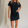 full body view of female model wearing the Elsie Ribbed Short Sleeve Mini Dress which features Ribbed Fabric, Mini Length, Left Front Chest Pocket, Short Sleeves and Round Neckline. the dress is available in black and blue.